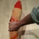 Look again at where I am holding the towel. Notice that my hand is almost two hand-widths up from the edge of the towel. This is a natural balance point for your towel, and will allow you to strike quickly. Do NOT hold the towel on the very end as