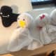 Little ghosts made with scrap fabric, stuffing, puff paint, and googly eyes.