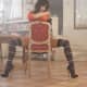 Kate Beckinsale straddles a chair with her long legs wearing thigh high stockings and high heels stilettos in a magazine photoshoot