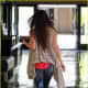 Megan Fox in torn and tight jeans and high heels