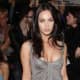 Megan Fox in a short gray dress and high heels
