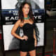 Megan Fox in a short black dress and high heels