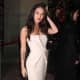 Megan Fox in a white dress and high heels