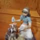 Lladro porcelain with girl ministering to a dog