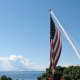 Geraniums &amp; U.S. flag on the porch 