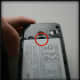 On the LG Rumor Touch there is a small cutout for using your fingernail to remove the battery. Most phones will have some sort of notch to all you to slip a fingernail or a small object to remove the battery.