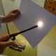 Move a lighter or candle back and forth across the message to make it disappear.
