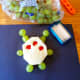 Use green grapes and toothpicks to create arms, legs, and antennae.