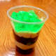 Layer the Oreos and pudding. Top with green Jell-O.