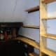 New shelving butted against original shelves.