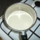 Cream is poured in to a large pot
