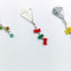 How cute are these kites with their polymer clay bows or glass bead dangles? The dangles will add a lot of fun movement to whatever you wear these on.