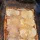 Completed layer of cheese, using shredded cheeses to fill in gaps between mozzarella slices.