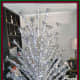 This vintage, mid-century, 8-foot Ever-Gleam 121-branch silver stainless aluminum fountain tree is a beautiful blast from the past.