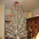 This is one of our aluminum trees that we put up every year. Here's how it looks with the decorations in progress.