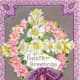 Cross made of white and yellow flowers surrounded by ring of pink flowers with purple ribbon and bow