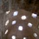 Alhambra: bath house, ceiling: Star openings in the ceiling and upper wall.