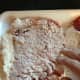 Using the flour around the sides, coat the entire top of the cube steak.