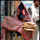 A Yemeni woman wearing the Sana'ani Sitarah in a local market of Sana'a city