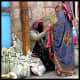 A female Yemeni seller wearing the Sana'ani Sitarah in a local market of Sana'a city