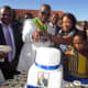 Vhavenda King, Toni Mphephu Ramabulana helped by the Queen Hulisani Ramabulana to cut the cake of his birthday, while Thovhele Kennedy Tshivhase (left) looked on and traditional leaders and community at large ululated.