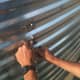 A person with a box-end wrench assists on the outside to hold the bolts still. The wrench may also be used to tap to show the location of a problem.