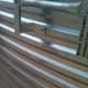 Manufacturer's specifications are written with a permanent marker on this ladder section.