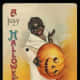 Vintage Halloween card: African American boy with carved Jack-o-lantern