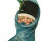 Vintage Christmas stocking with little girl in it