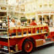 Red firetruck offering transportation in Main Street USA