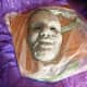 Here Tadpole begins to model some foliage on the mask. It is a long and messy job, hence the plastic.