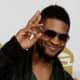 Usher, 34, at the Grammys.  Usher is wearing a medium square hair style for black men.  Usher's hair is cut short on both sides and long on top.  Very trendy. - 2013 Hairstyles for Men Short Medium Long Hair Styles Haircuts, by Rosie2010