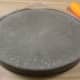 Using the handle of your screwdriver gently tap the edges of the mold for at least 30 seconds to burp the cement of any air bubbles. Allow the stone to sit undisturbed for six to eight hours.