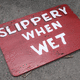 Slippery when wet! Sign just left around the pool area.  Photo - Edward M. Fielding