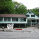 Poltergeist activity at the old dining hall down by the Salmon River. Notice the dining room chairs on the roof! Photo - Edward M. Fielding
