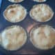 Pricking the tops of the chicken pot pies pre-baking