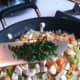 Mixing in the herbs after chicken was sauteed with garlic, celery, and carrots