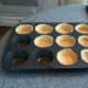 Filling the pan with the pie crust. I tried to stretch it as much as possible to the top of the muffin tin.