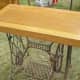 Upcycled antique table made from sewing machine and piano parts