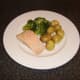 Salmon poached in white wine with new potatoes and broccoli