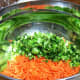 Shredded carrots & chopped broccoli in large mixing bowl.