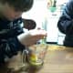 Kids should crack eggs into a separate container, so it is easier to remove any shells that sneak in.