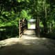 A bridge that leads to a residential neighborhood.