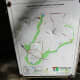 A sign marker near the entrance showing you where you are on the trail.