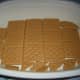 Graham Crackers lined at the bottom of a dessert bowl.