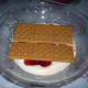Add strawberry pie filling followed by Graham Crackers.