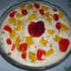 Decorated Mango Strawberry Cream Dessert with Graham Crackers crumbs.