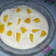 Add mango slices and cream mixture. Then decorate with small slices of mangoes.