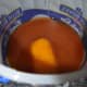Mixing the alcohol with the juice.