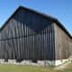 If the siding had been put on horizontally, rainwater would have collected on the edges of boards, causing them to rot.